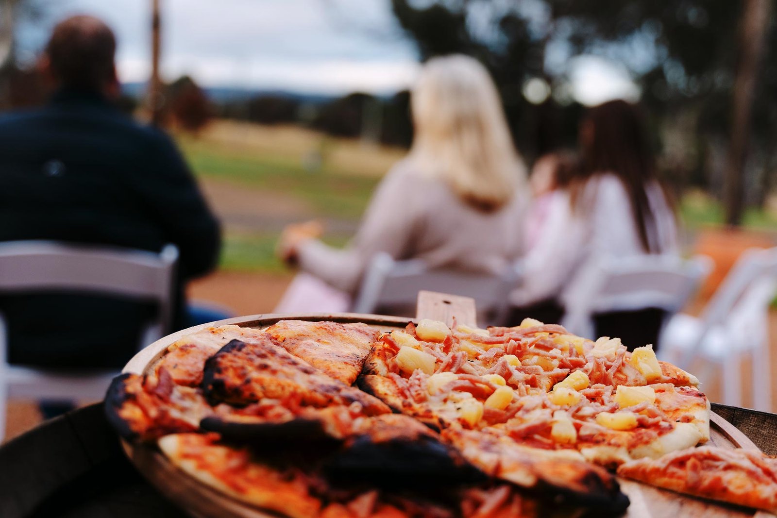 Pizza cooking in a wood-fired oven